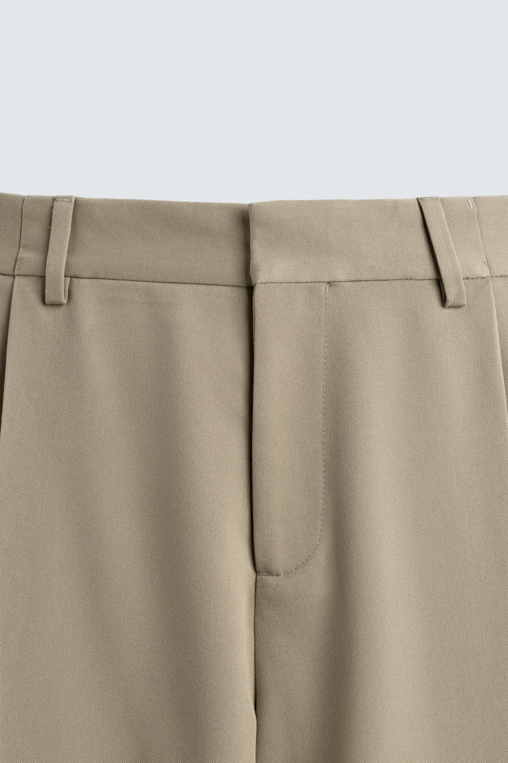 PANTALON COUPE LARGE À PLIS
